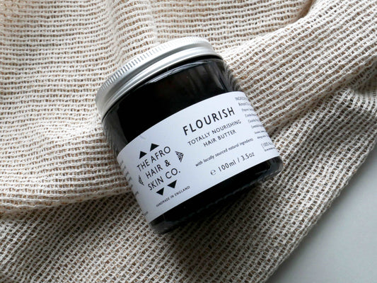FLOURISH - Totally Nourishing Hair Butter afro hair product in a amber glass jar