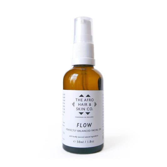 Flow perfectly balanced facial oil againsta a white background. Skincare for black people.